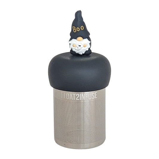 black gnome with a hat that reads "boo" holding a ghost tea infuser for loose leaf tea  with a fine mesh stainless steel tea infuser that reads FLOAT2INFUSE on a black base with a white background