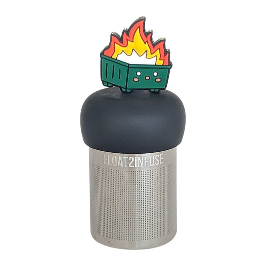 flames erupting out of the center of a happy green dumpster tea infuser for loose leaf tea  with a fine mesh stainless steel tea infuser that reads FLOAT2INFUSE on a black base with a white background