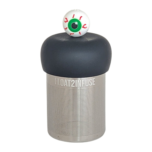 green eyed eyeball tea infuser for loose leaf tea  with a fine mesh stainless steel tea infuser that reads FLOAT2INFUSE on a black base with a white background