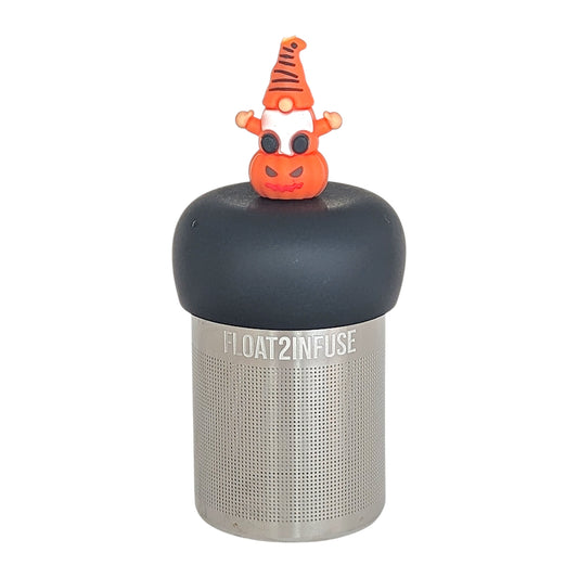 spooky orange gnome on a jack-o-lantern pumpkin tea infuser for loose leaf tea  with a fine mesh stainless steel tea infuser that reads FLOAT2INFUSE on a black base with a white background