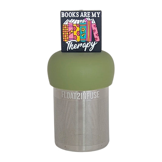 black square with text that reads "books are my therapy" on books tea infuser for loose leaf tea  with a fine mesh stainless steel tea infuser that reads FLOAT2INFUSE on a green base with a white background