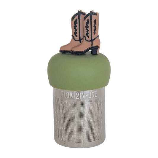 brown cowboy boots tea infuser for loose leaf tea with a fine mesh stainless steel tea infuser that reads FLOAT2INFUSEon a green base with a white background