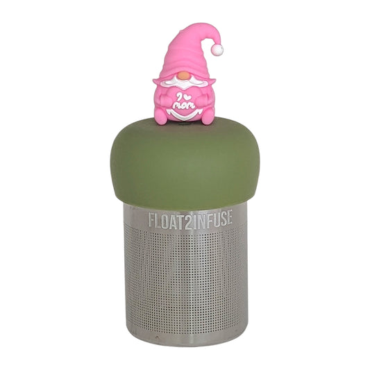 pink gnome holding a heart that reads "i love mom" tea infuser for loose leaf tea  with a fine mesh stainless steel tea infuser that reads FLOAT2INFUSE on a green base with  a white background