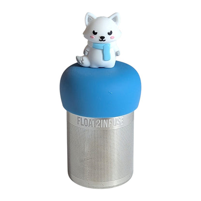 White Arctic fox wearing a blue scarf tea infuser for loose leaf tea with a fine mesh stainless steel tea strainer that reads FLOAT2INFUSE on a green base with a  white background
