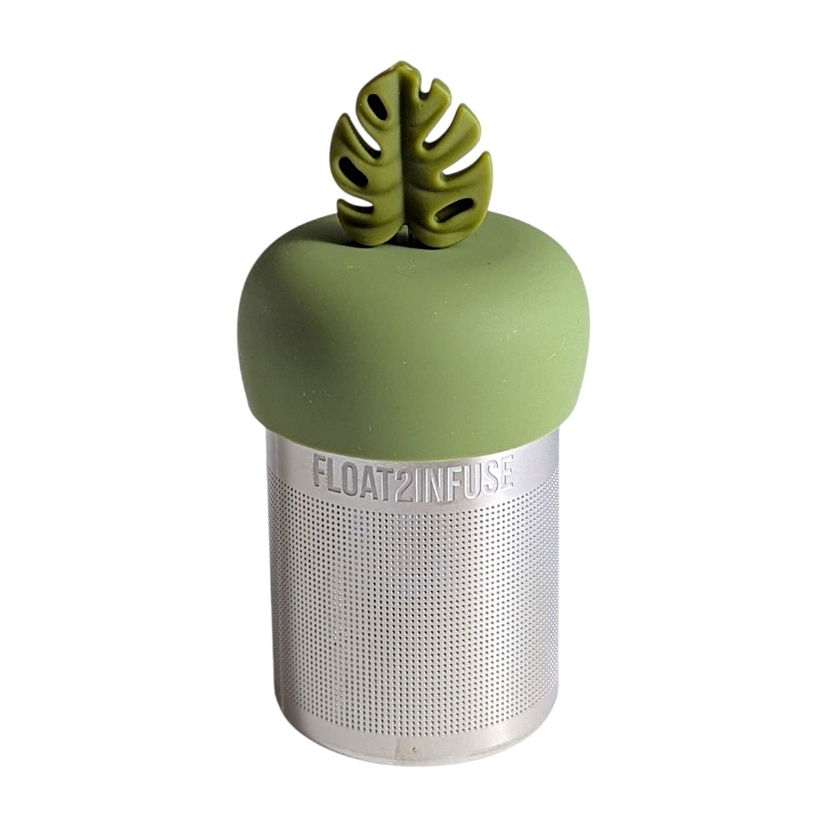army green monstera leaf tea infuser for loose leaf tea with a fine mesh stainless steel tea infuser that reads FLOAT2INFUSE on a green base with a white background