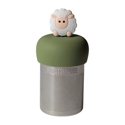 Smiling baby sheep tea infuser for loose leaf tea with a fine mesh stainless steel tea strainer that reads FLOAT2INFUSE on a green base with a white background
