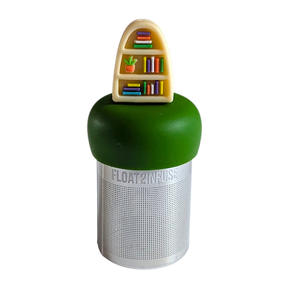 blonde plant bookshelf tea infuser for loose leaf tea  with a fine mesh stainless steel tea infuser that reads FLOAT2INFUSE on a dark green base with a white background