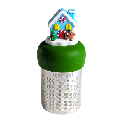Cute snow covered blue house ready for the holidays with a gingerbread man, red and white wreath, and Christmas tree decorations tea infuser for loose leaf tea with a fine mesh stainless steel tea strainer that reads FLOAT2INFUSE on a dark green base with a  white background
