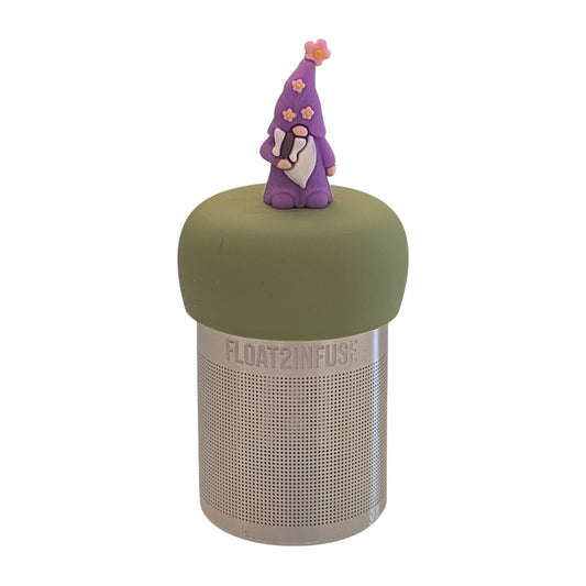Cute wizard wearing a purple robe with pink flowers and holding a butterfly wand tea infuser for loose leaf tea with a fine mesh stainless steel tea strainer 
that reads FLOAT2INFUSE on a green base with a white background
