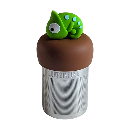 green chameleon animal tea infuser for loose leaf tea with a fine mesh stainless steel tea strainer that reads FLOAT2INFUSE on a brown base with a white background