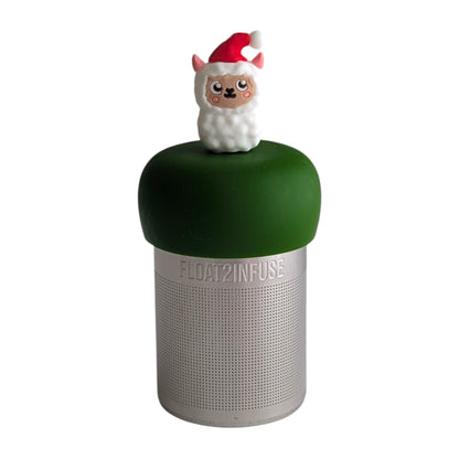 Cute llama wearing a santa hat tea infuser for loose leaf tea with a fine mesh stainless steel tea strainer 
that reads FLOAT2INFUSE on a dark green base with a white background
