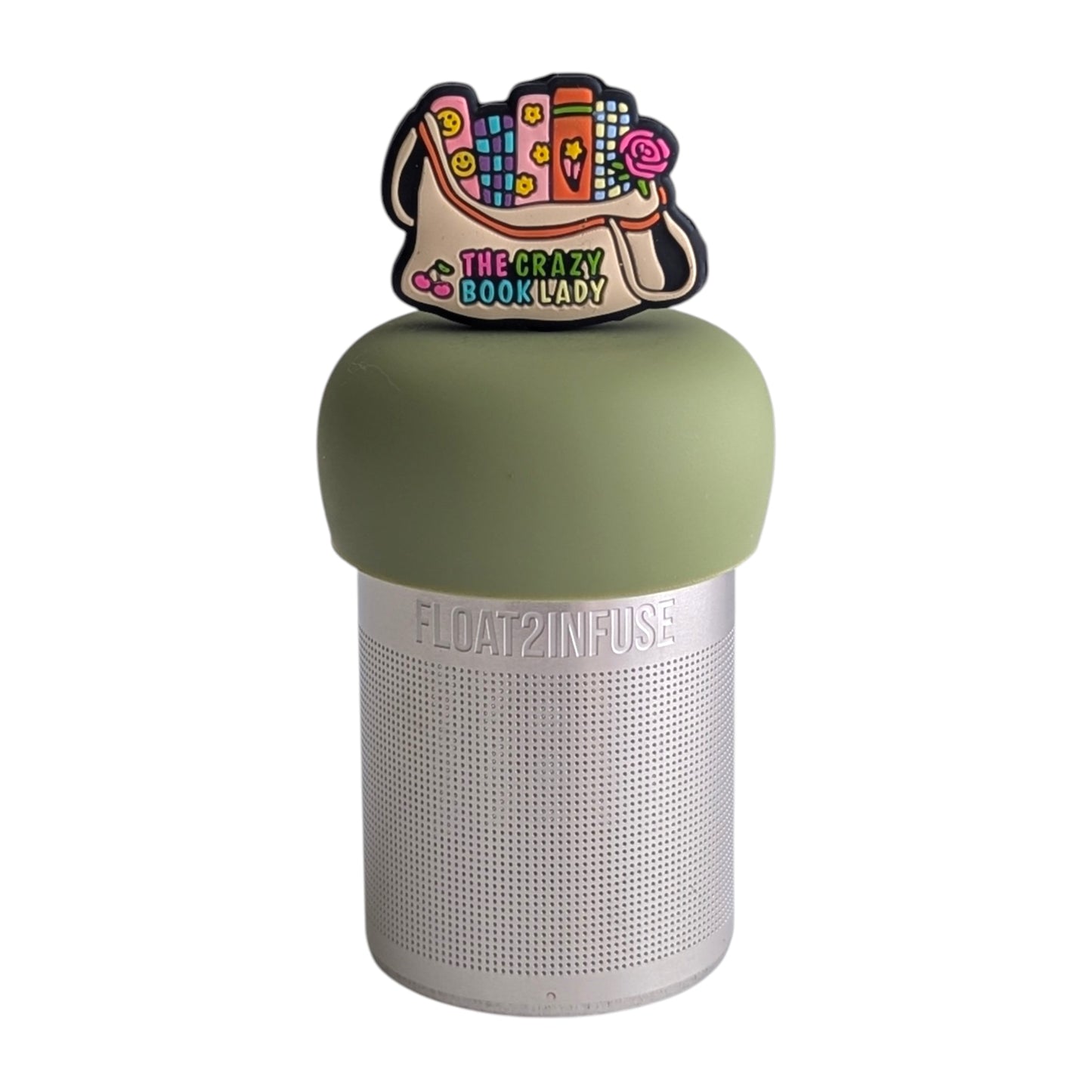 Beige bag with several brightly colored books sticking out the top and  the text "the crazy book lady" written on the bottom tea infuser for loose leaf tea with a fine mesh stainless steel tea strainer 
that reads FLOAT2INFUSE on a green base with a white background
