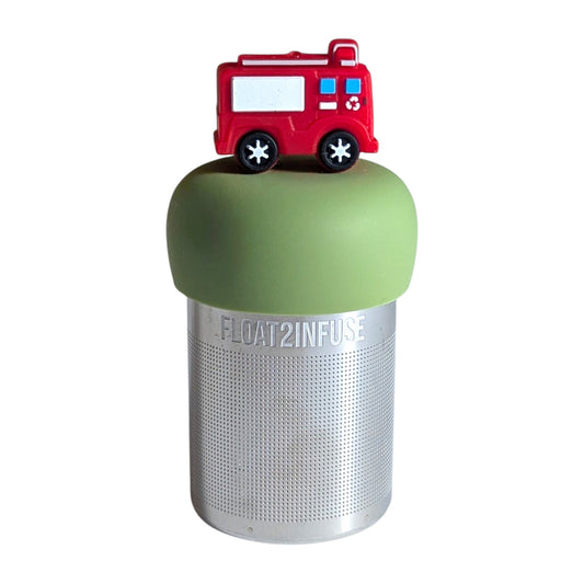 Cute red firetruck tea infuser for loose leaf tea with a fine mesh stainless steel tea strainer that reads FLOAT2INFUSE on a green base with a  white background
