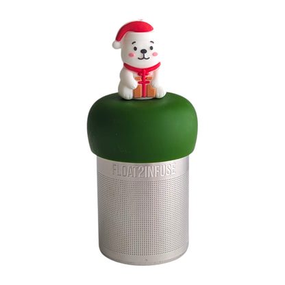 Polar bear wearing a santa hat and holding a present with a big red bow tea infuser  for loose leaf tea with fine mesh stainless steel tea strainer that reads FLOAT2INFUSE on a dark green base with white background