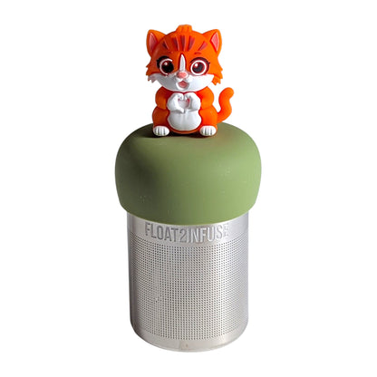 Cute orange kitty making a heart with her paws tea infuser for loose leaf tea with a fine mesh stainless steel tea strainer that reads FLOAT2INFUSE on a green base with a white background
