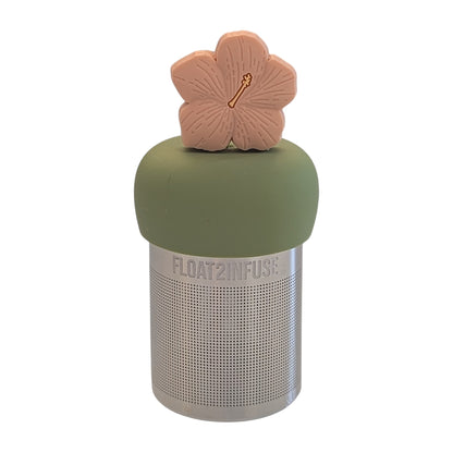 Peach colored hibiscus flower tea infuser for loose leaf tea with a fine mesh stainless steel tea strainer 
that reads FLOAT2INFUSE on a green base with a white background