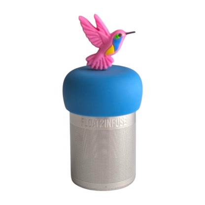 Pink hummingbird with yellow, blue and green on its belly tea infuser for loose leaf tea with a fine mesh stainless steel tea strainer 
that reads FLOAT2INFUSE on a blue base with a white background
