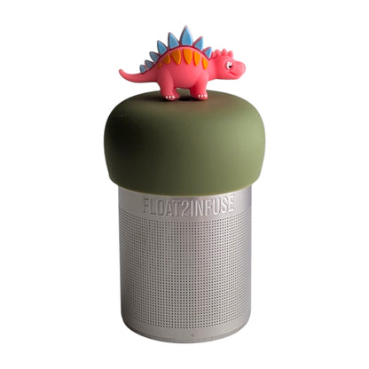 cute pink stegosaurus with blue spikes tea infuser for loose leaf tea with a fine mesh stainless steel tea strainer 
that reads FLOAT2INFUSE on a green base with a white background
