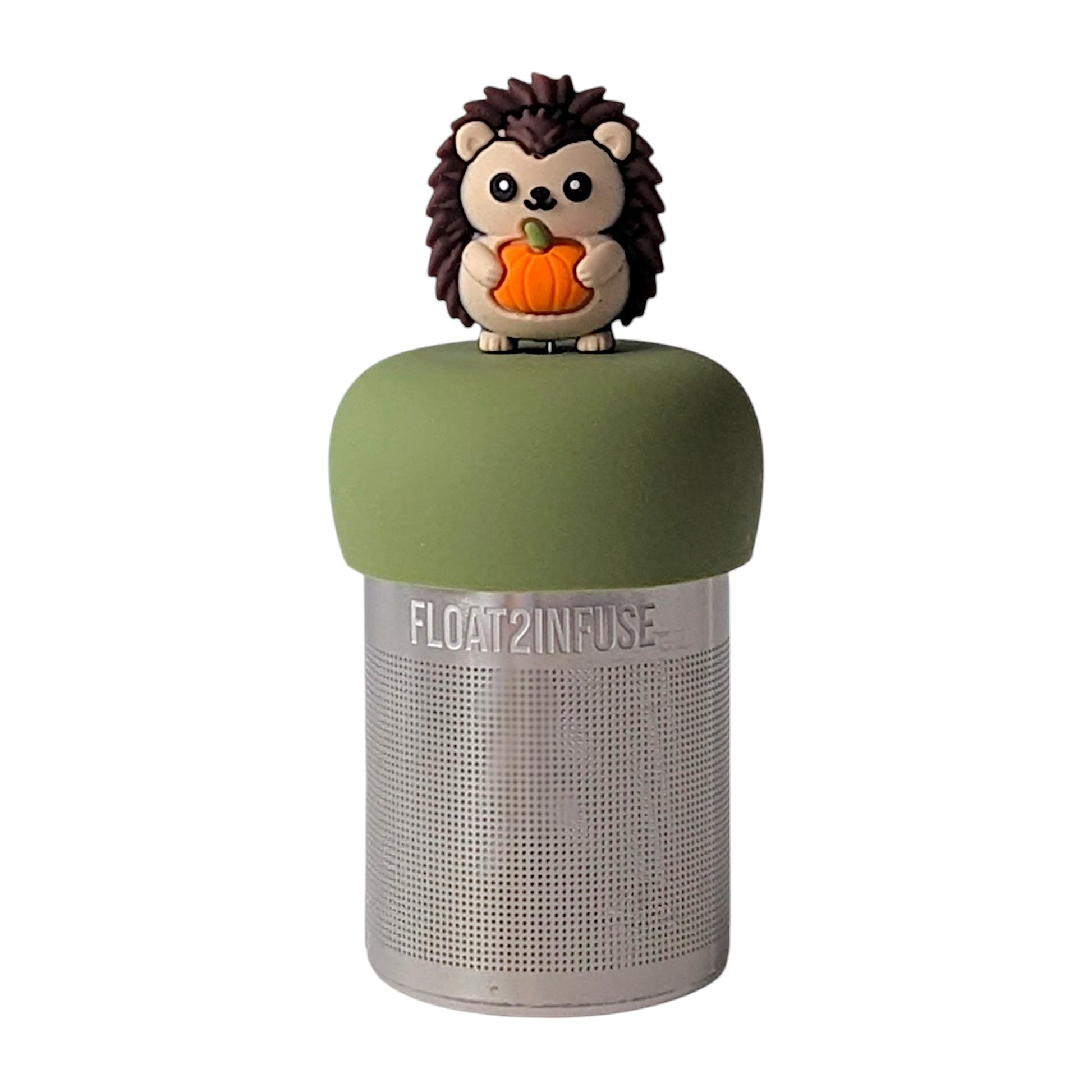 Cute hedgehog holding a pumpkin tea infuser for loose leaf tea with a fine mesh stainless steel tea strainer that reads FLOAT2INFUSE on a green base with a white background