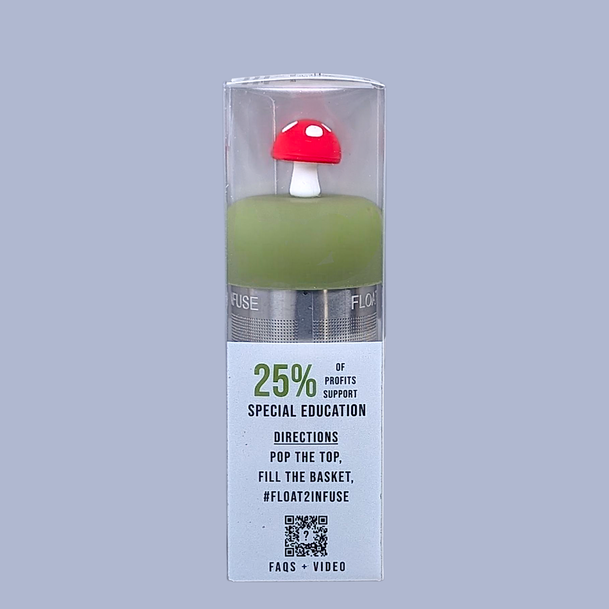 floating red mushroom tea infuser in clear gift box left side view