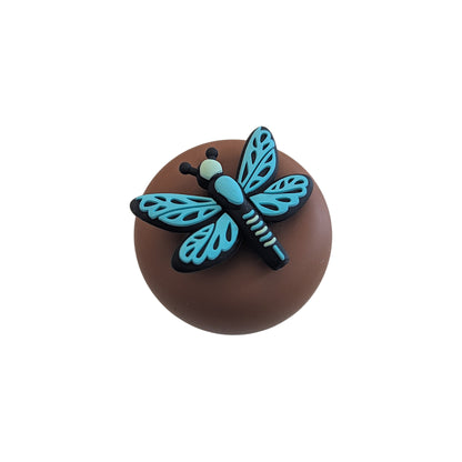 Turquoise dragonfly tea infuser for loose leaf tea with a fine mesh stainless steel tea strainer 
that reads FLOAT2INFUSE on a brown base with a white background
