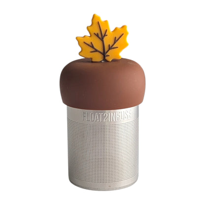 Fall yellow maple leaf tea infuser for loose leaf tea with a fine mesh stainless steel tea strainer 
that reads FLOAT2INFUSE on a brown base with a white background
