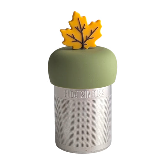 Fall yellow maple leaf tea infuser for loose leaf tea with a fine mesh stainless steel tea strainer 
that reads FLOAT2INFUSE on a green base with a white background
