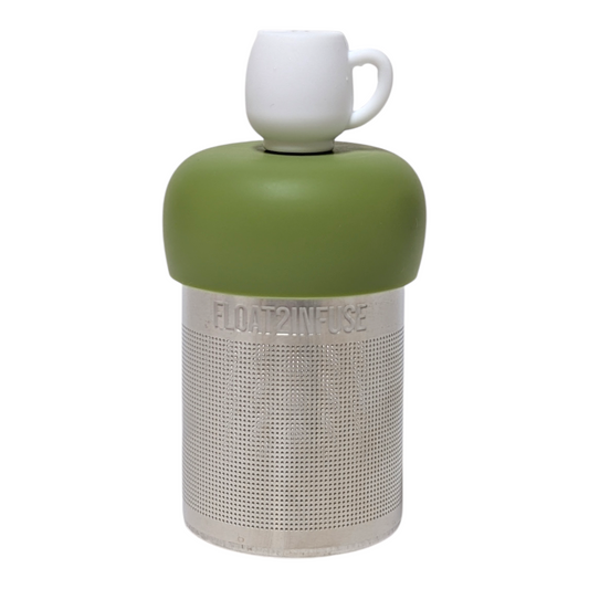White mug tea infuser  for loose leaf tea with a fine mesh stainless steel tea strainer that reads FLOAT2INFUSE on a green base with a white background