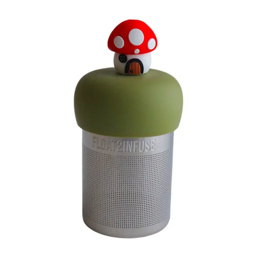red mushroom cottage tea infuser on a white background