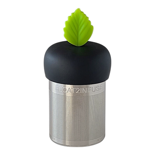  Bright green leaf tea infuser with a black base for loose leaf tea with a fine mesh stainless steel tea strainer that reads FLOAT2INFUSE with a white background