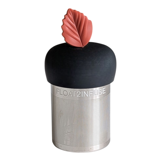 red fall leaf tea infuser for loose leaf tea with fine mesh stainless steel tea strainer that reads FLOAT2INFUSE on a black base with a white background