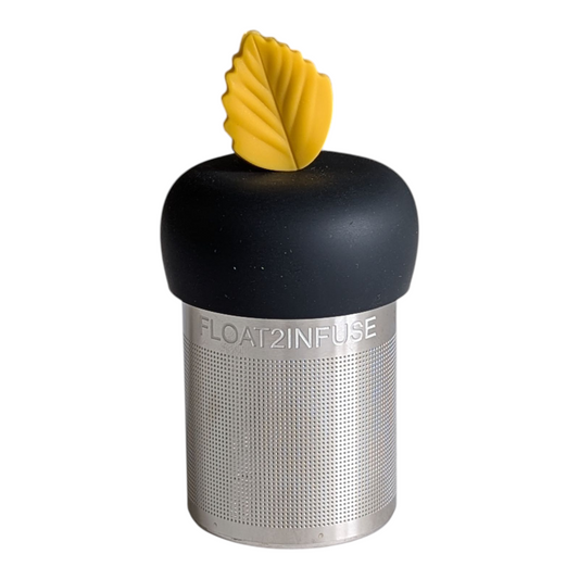yellow fall leaf tea infuser for loose leaf tea with fine mesh stainless steel tea strainer that reads FLOAT2INFUSE on a black base with a white background
