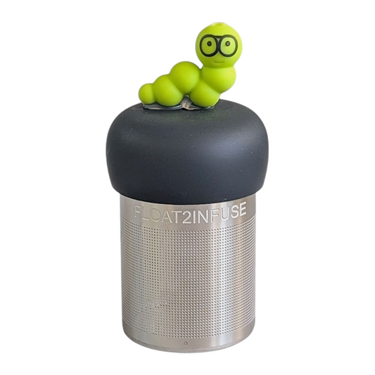 green bookworm wearing black rim glasses tea infuser  for loose leaf tea with fine mesh stainless steel tea strainer that reads FLOAT2INFUSE on a black base with a white background