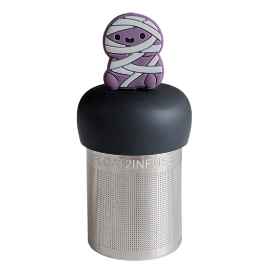 purple mummy tea infuser for loose leaf tea  with a fine mesh stainless steel tea infuser that reads FLOAT2INFUSE on a black base with a white background