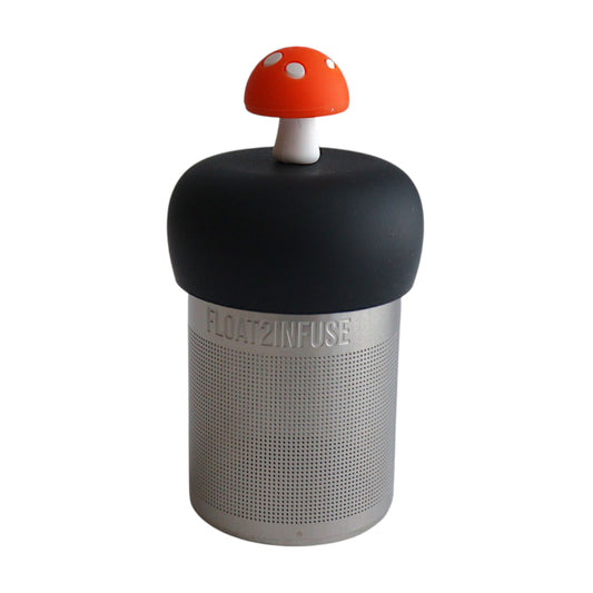 Orange mushroom tea infuser for loose leaf tea with a fine mesh stainless steel tea strainer that reads FLOAT2INFUSE on a black base with a white background
