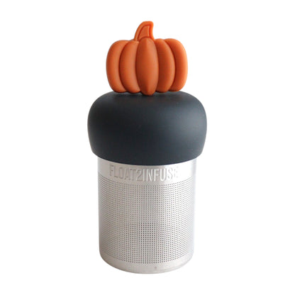 orange pumpkin tea infuser for loose leaf tea  with a fine mesh stainless steel tea infuser on a black base with a white background
