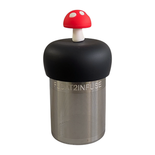 red mushroom tea infuser for loose leaf tea  with a fine mesh stainless steel strainer that reads FLOAT2INFUSE on a black base with a white background