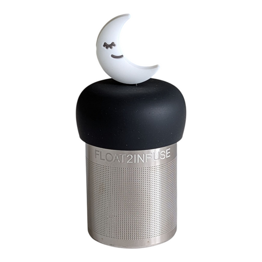 white smiling crescent moon tea infuser for loose leaf tea with a fine mesh stainless steel tea strainer that reads FLOAT2INFUSE on a black base with a white background