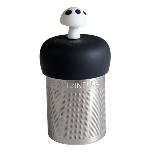 white and black mushroom tea infuser for loose leaf tea  with a fine mesh stainless steel strainer that reads FLOAT2INFUSE on a black base with a white background