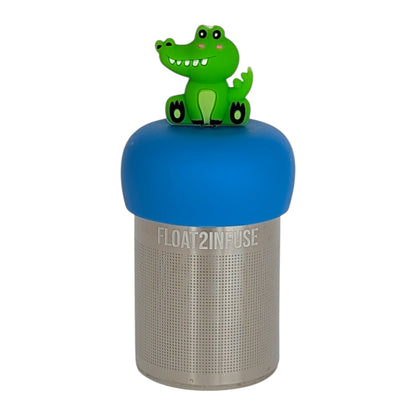 happy green alligator tea infuser  for loose leaf tea with fine mesh stainless steel tea strainer that reads FLOAT2INFUSE on a blue base with white background