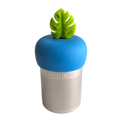 lime green monstera leaf tea infuser for loose leaf tea with fine mesh stainless steel tea strainer that reads FLOAT2INFUSE on a blue base with a white background