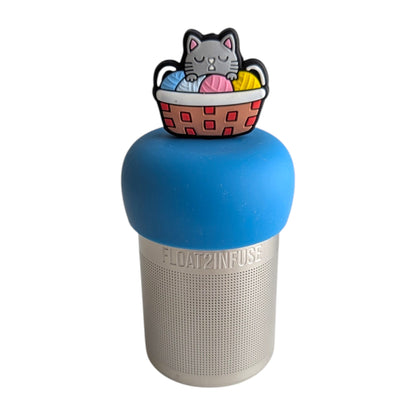 grey cat in colorful knitting basket animal  tea infuser for Loose leaf tea with a fine mesh stainless steel Tea steeper that reads FLOAT2INFUSE on blue base 