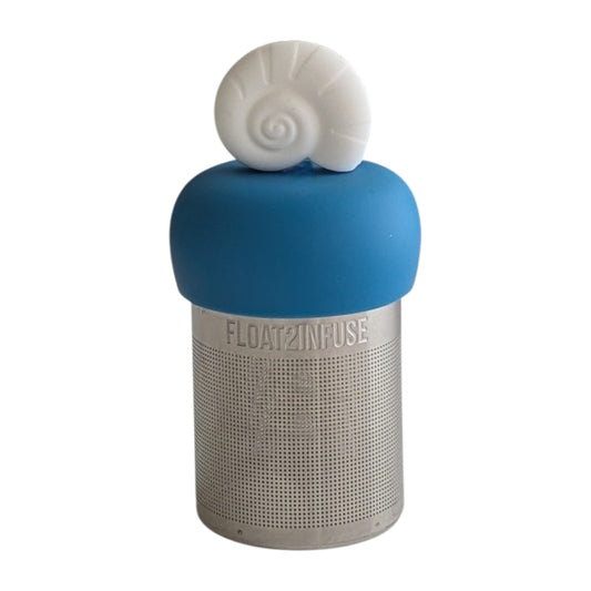 Fossil sea shell tea infuser for loose leaf tea on a blue base with a fine mesh stainless steel tea strainer that reads FLOAT2INFUSE with a white background