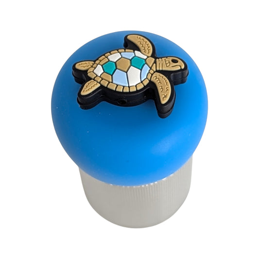 tan and blue sea turtle tea infuser with blue base for loose leaf tea with fine mesh stainless steel tea strainer that reads FLOAT2INFUSE with white background