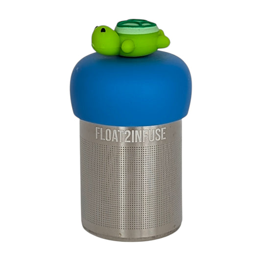 green turtle tea infuser with blue base for loose leaf tea with fine mesh stainless steel tea strainer that reads FLOAT2INFUSE with white background