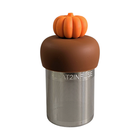 3d orange pumpkin tea infuser for loose leaf tea with fine mesh stainless steel tea strainer that reads FLOAT2INFUSE on a brown base with a white background