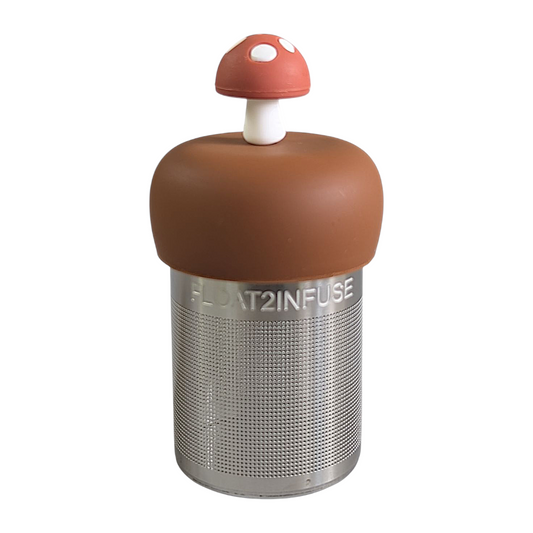 chestnut brown mushroom with white dots tea infuser for loose leaf tea with a fine mesh stainless steel tea strainer that reads FLOAT2INFUSE on a brown base with a white background