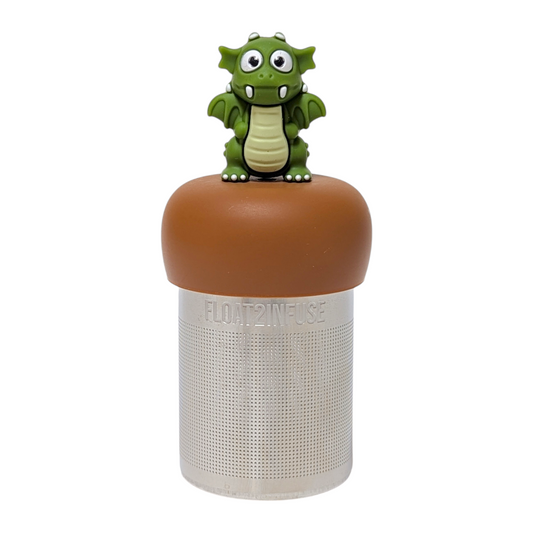 Dark green dragon animal tea infuser for loose leaf tea with a fine mesh stainless steel tea strainer that reads FLOAT2INFUSE on a brown base  with a white background