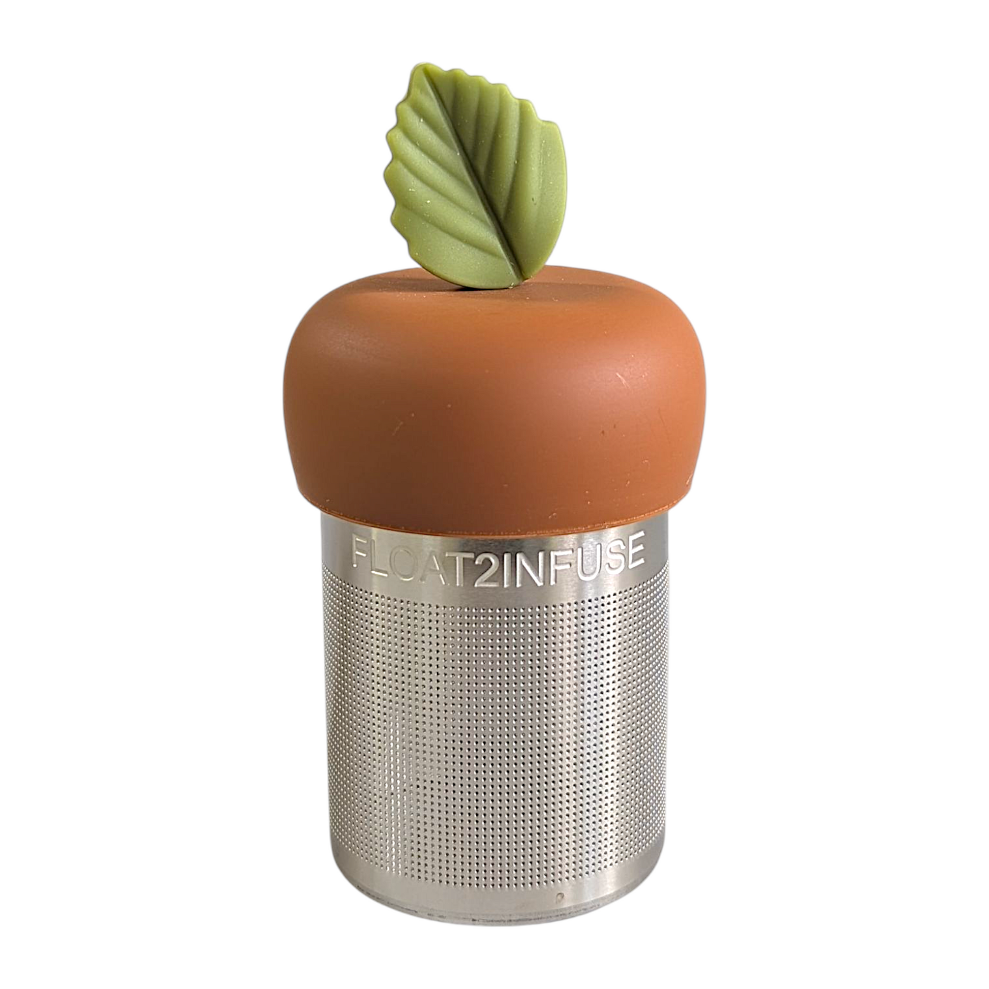 green herb leaf tea infuser for loose leaf tea with a fine mesh stainless steel tea strainer that reads FLOAT2INFUSE on a brown base with a white background