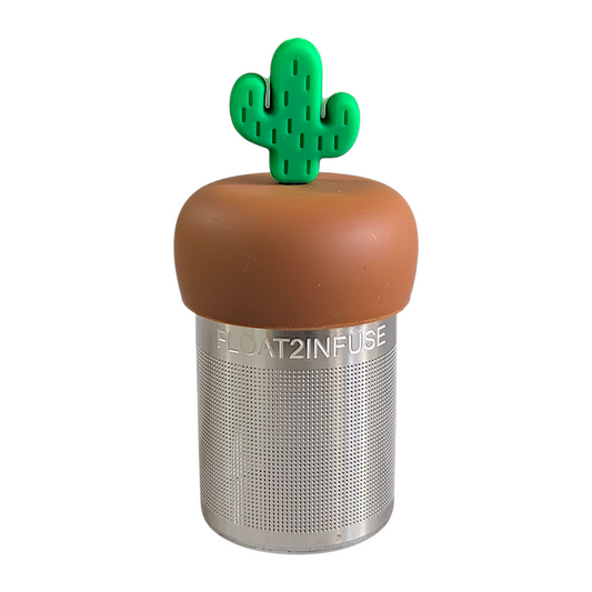 green cactus tea infuser for loose leaf tea with fine mesh stainless steel tea strainer that reads FLOAT2INFUSE on a brown base with a white background